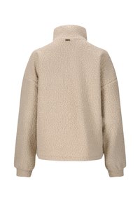 Beige Fleecejacke mit hohem Kragen, oversized Design und strukturiertem Stoff. Verfügt über abfallende Schultern und gerippte Bündchen für zusätzlichen Komfort.