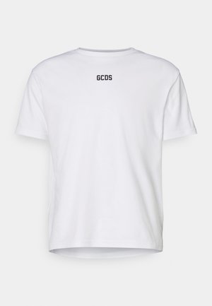 White cotton t-shirt with short sleeves, featuring a round neckline and "GCDS" logo printed in black on the back. Simple, unadorned design.