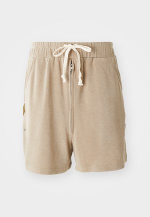 Pantalones cortos beige de tejido texturizado, con cintura elástica y cordón ajustable, bolsillos laterales y cierre con cremallera.