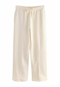 Cream-colored sweatpants with an elastic waistband and drawstring, featuring a relaxed fit and smooth texture. No visible patterns.