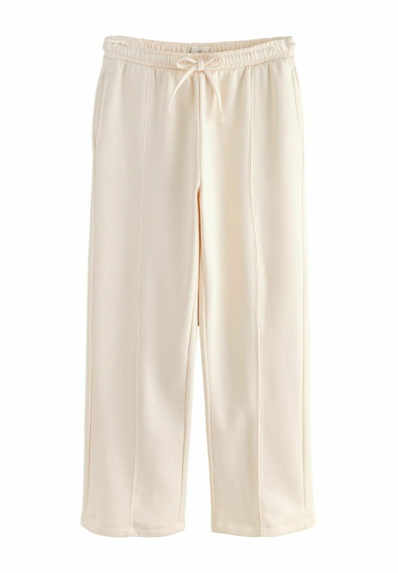 Cream-colored sweatpants with an elastic waistband and drawstring, featuring a relaxed fit and smooth texture. No visible patterns.