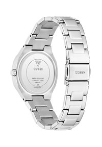 Montre en acier inoxydable avec une finition métallique argentée, dotée d'un boîtier rond, d'une lunette lisse et d'un design de bracelet articulé.