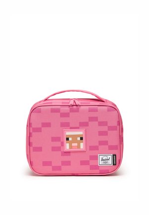 Bright pink rectangular lunch bag with pixelated pattern, Minecraft pig face design, top handle, and Herschel Supply Co. label on the front.