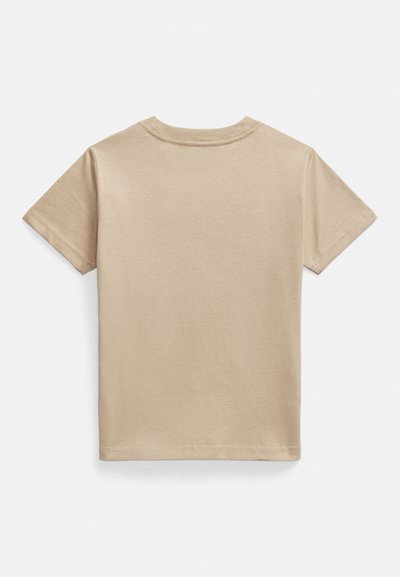 Beige kortärmad T-shirt i mjuk bomull. Klassisk rund halsringning, enfärgad design utan mönster eller detaljer. Slät textur.