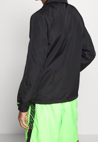 New Era Träningsjacka - black