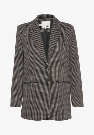 Blazer à rayures noires et blanches avec deux boutons, revers cranté et poches avant. Tissu texturé avec une coupe ajustée et une silhouette structurée.