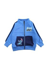 Veste bleu à fermeture éclair avec deux poches avant, comportant un personnage de dessin animé sur la poche gauche et des accents bleu marine dans le design.