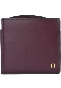 Burgundy leather wallet with a smooth texture and rounded top, featuring gold hardware logo and contrasting black stitching details.