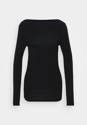 Top noir à manches longues en matière extensible, présentant un col rond et des détails froncés sur les côtés pour une silhouette ajustée.