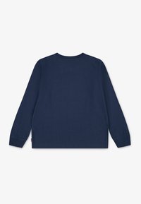 Navy sininen pitkähihaisen t-paita, joka on valmistettu puuvillasta, ja siinä on pyöreä pääntie ja kapeat hihansuut. Yksinkertainen selkäosa, jossa on pieni logo helman lähellä.