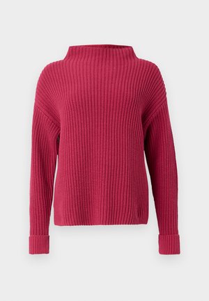 Dikke gebreide trui in diep roze met een hoge hals en lange mouwen. Heeft een geribbelde textuur en brede manchetten. Klassiek pullover ontwerp.