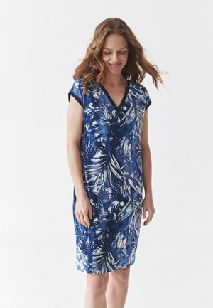 Blauwe jurk met bloemenprint, een V-hals, korte mouwen en een relaxed fit. Gemaakt van lichtgewicht stof met een zachte textuur en subtiele glans.