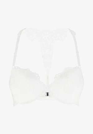 White lacy bra with a V-shaped back, featuring intricate patterns, adjustable straps, and a silver clasp detail at the front center.