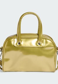 Glossy yellow handbag with a rounded shape, dual short handles, and metal accents. Features a zippered closure and smooth texture.