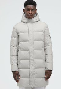 Light gray puffer coat featuring a hood, quilted panels, and two side pockets, made from smooth, weather-resistant fabric.