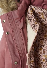 Pink outer jacket with a faux fur trim, zip closure, and a floral patterned lining. Features textured fabric and silver hardware details.