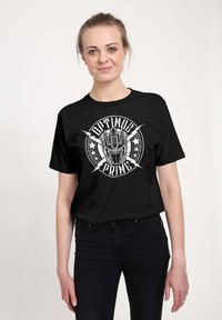 Czarny bawełniany t-shirt z białą grafiką głowy Optimusa Prime'a oraz napisami "OPTIMUS PRIME" i akcentami w kształcie błyskawic.