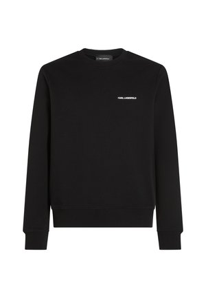 Melnā džemperis, kas izgatavots no mīksta auduma, ar apaļu kakla izgriezumu, ribotiem piedurknēm un mazu baltu "KARL LAGERFELD" logotipu uz krūtīm.