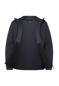 Veste matelassée marine à manches longues, fermeture éclair avant partiellement ouverte, montrant une doublure intérieure lisse et des panneaux latéraux noirs.