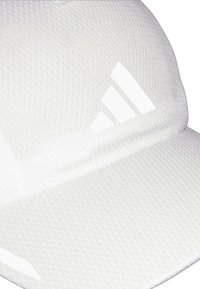 White cap made of textured material featuring a mesh design. Notable accents include three white stripes logo on the front.