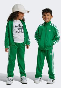 adidas Originals FIREBIRD UNISEX  - Verryttelyhousut - green