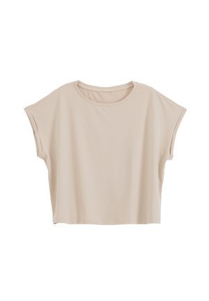 Haut court beige à manches courtes, col rond et coupe décontractée, présenté sur fond blanc.