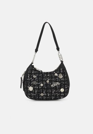 Black tweed handbag with silver hardware, featuring decorative buttons and an embroidered logo. Smooth black accents and adjustable strap.