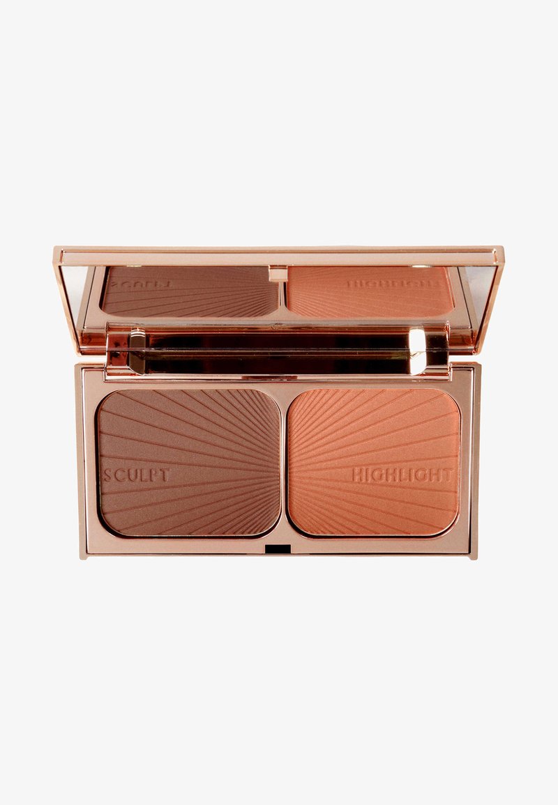 Rose gold compact with two sections labeled "SCULPT" (dark brown) and "HIGHLIGHT" (peach). Textured surface with radial pattern design.