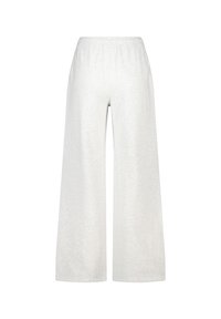 Housut, joissa on leveät lahkeet, harmaat collegehousut pehmeästä puuvillasekoitteesta. Rento istuvuus ja elastinen vyötärö lisäävät mukavuutta. Taskuja ei ole näkyvissä.