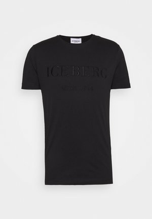 Musta lyhythihainen t-paita pyöreällä kaula-aukolla ja kohokuvioidulla tekstillä "ICEBERG since 1974" edessä.