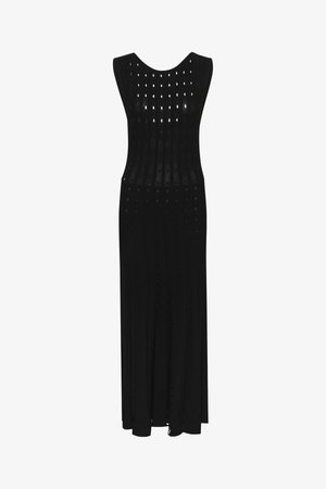 Black sleeveless maxi dress made of textured fabric with vertical cut-out patterns, featuring a round neckline and a floor-length silhouette.