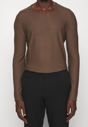 Stickad tröja - brown