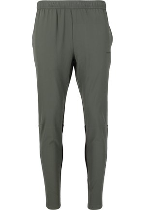 Groene sportbroek van lichtgewicht, ademend materiaal. Heeft een elastische tailleband en zwarte zijpanelen voor contrast.