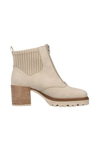 Beige ankle boot with a textured ribbed elastic panel, front zip closure, and a stacked block heel with a grooved sole for traction.