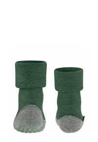 Calze lavorate a maglia verde scuro con risvolto, suola grigia con battistrada per maggiore aderenza e superficie liscia. Progettate per comfort e stabilità.