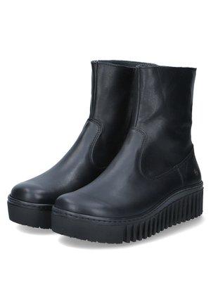 Botas de tobillo de cuero negro con un acabado suave, paneles laterales elásticos y suela de goma gruesa con surcos profundos para mayor tracción.