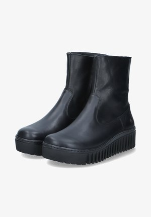 Bottes de cheville en cuir noir avec une finition lisse, panneaux élastiques sur les côtés et une semelle en caoutchouc épaisse avec des rainures profondes pour une meilleure adhérence.
