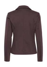 Dunkelbraune maßgeschneiderte Jacke mit weicher Textur, Ein-Knopf-Verschluss und Reverskragen. Mit Nahtdetails und langen Ärmeln.