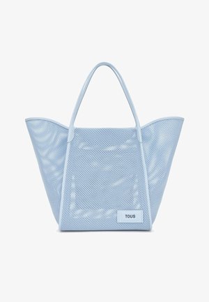 Borsa tote in rete azzurro chiaro con due manici e una piccola etichetta con scritto "TOUS" nell'angolo inferiore destro sul davanti.