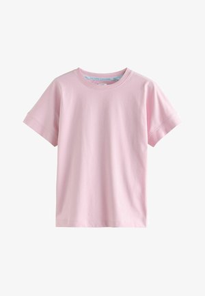 Jasnoróżowy bawełniany t-shirt z krótkimi rękawami, okrągłym dekoltem i luźnym krojem. Gładka faktura, bez widocznych wzorów czy akcentów.