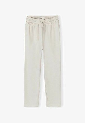 Pantalon de survêtement unisexe beige clair avec ceinture élastique, cordon de serrage et poches latérales, présenté à plat sur fond blanc.