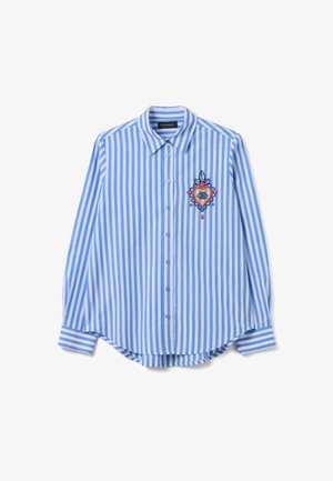 Langärmliges blau-weiß gestreiftes Shirt mit Knopfleiste und buntem gesticktem Herzen mit Auge auf der linken Brust.