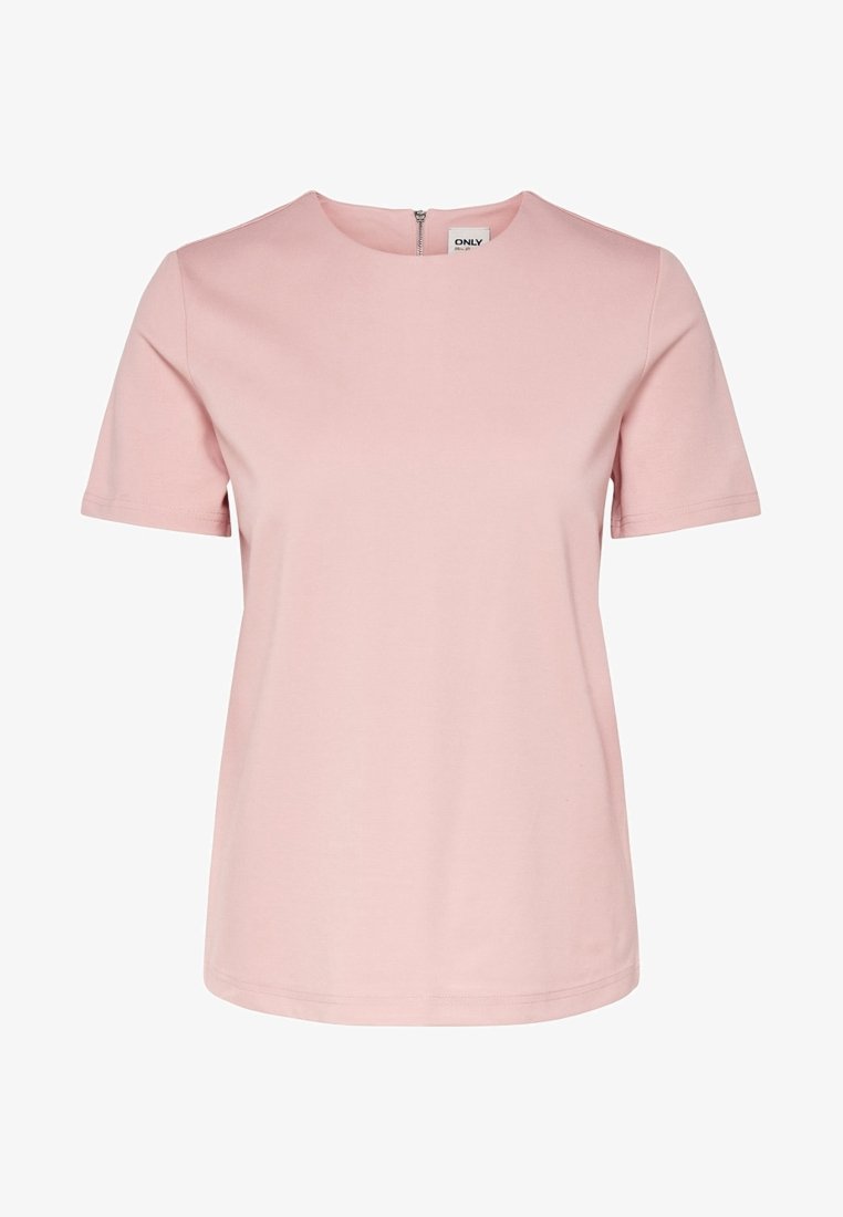 Haut féminin rose clair à manches courtes avec encolure ronde et fermeture éclair visible dans le dos, tissu uni et lisse, étiquette de la marque à l'intérieur du col.