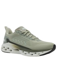Scarpa sportiva verde chiaro con tomaia in rete, accenti testurizzati e suola ammortizzata con camere d'aria visibili. La suola nera migliora la trazione.