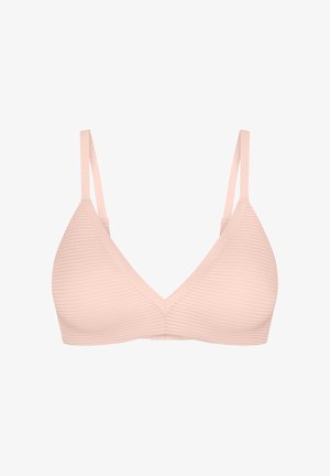Blød lyserød trådløs bh med let struktur, justerbare tynde stropper og dyb V-hals, vist mod en ensfarvet hvid baggrund.