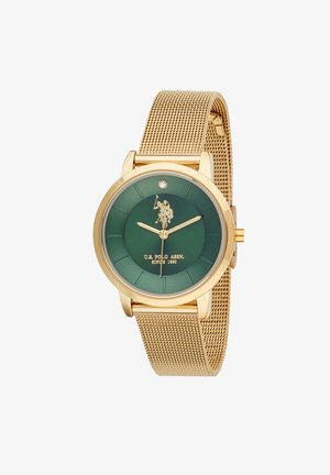 Orologio con cinturino in maglia d'oro, quadrante verde scuro, dettagli del logo in oro e un singolo diamante posizionato alle ore 12. Design cassa rotonda.