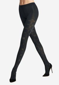 Collant neri con un motivo geometrico dorato, caratterizzati da una texture liscia e un alto punto vita, indossati con scarpe con tacco alto nere.