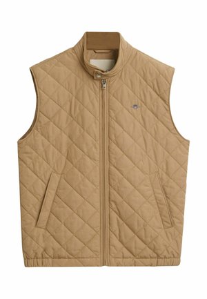 Gequilted beige vest met een opstaand kraag, een ritssluiting aan de voorkant en twee zijzakken. Bevat een klein geborduurd logo op de borst.
