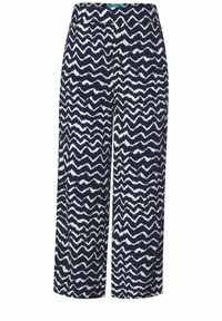 Mönstrade vida byxor med ett marinblått och vitt zigzag-mönster, tillverkade av lätt material och med elastisk midja.