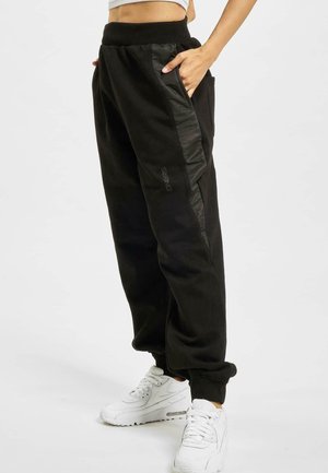 MAGGY - Tracksuit bottoms - black